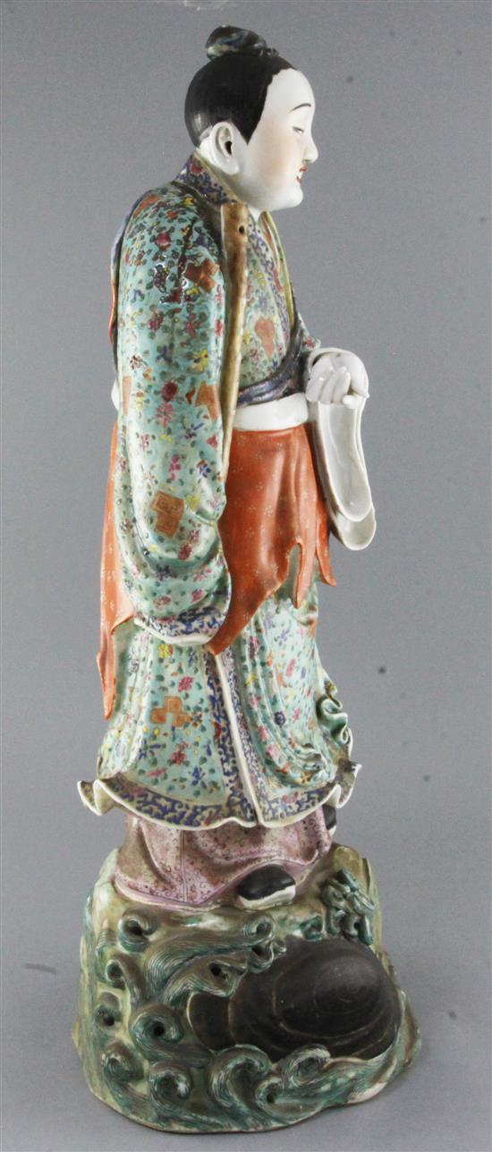 A large Chinese famille rose figure holding a flute, late 19th century